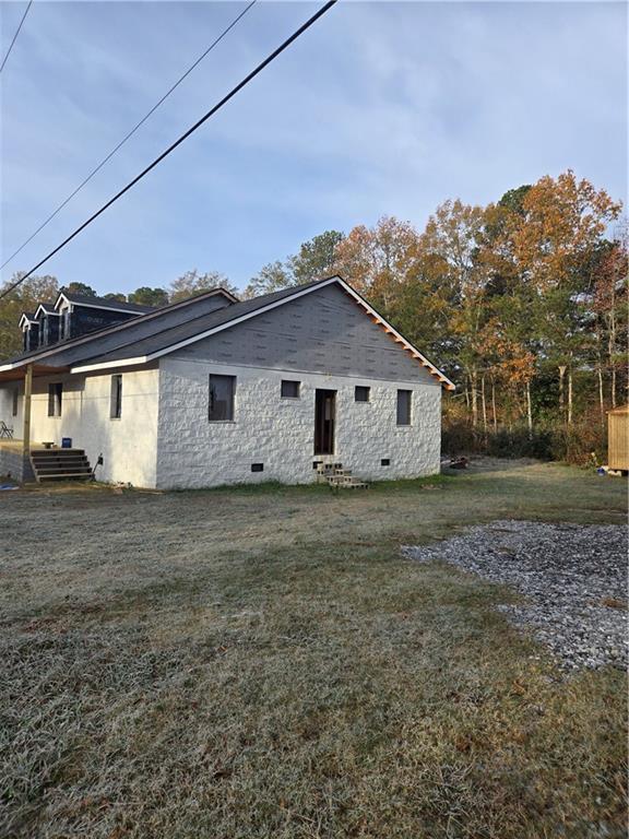 view of home's exterior featuring a yard