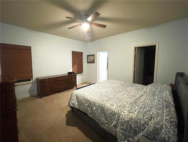 bedroom with light carpet and ceiling fan