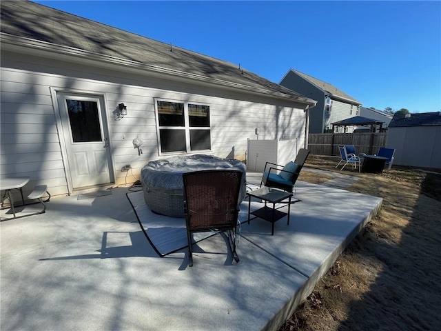 view of patio / terrace featuring fence