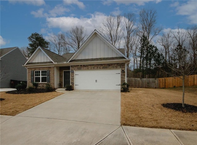 craftsman-style home with a garage, fence, concrete driveway, a front lawn, and board and batten siding