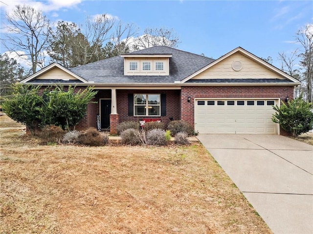 view of front of house with a garage and a front lawn