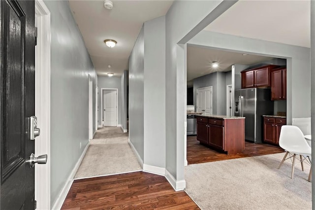 hallway with dark wood-type flooring