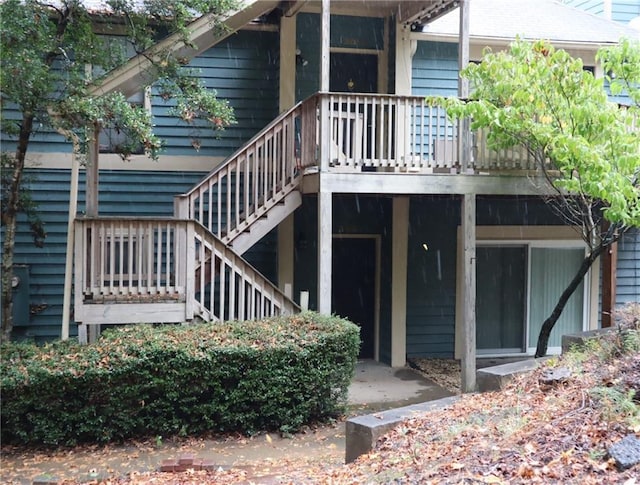 view of exterior entry featuring a deck