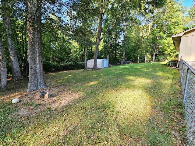 view of yard with a storage shed