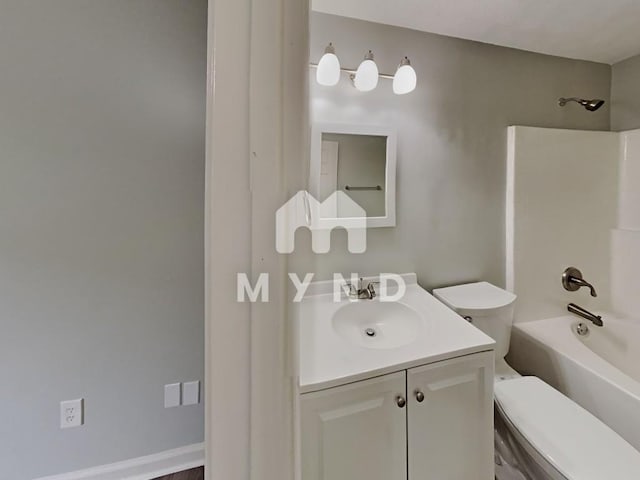 bathroom with vanity, toilet, and shower / tub combination
