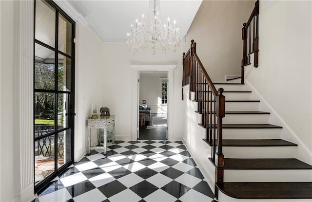 tiled entryway featuring an inviting chandelier