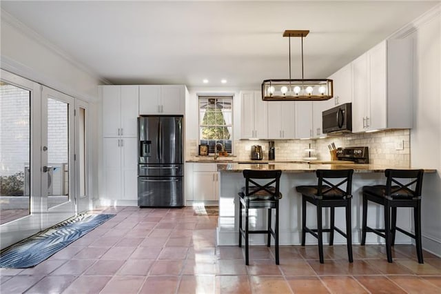 kitchen with a breakfast bar, white cabinetry, tile patterned floors, tasteful backsplash, and stainless steel fridge with ice dispenser