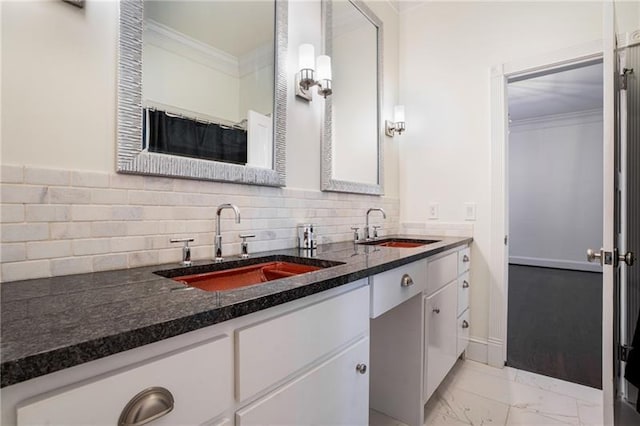 kitchen featuring sink, white cabinets, and dark stone counters