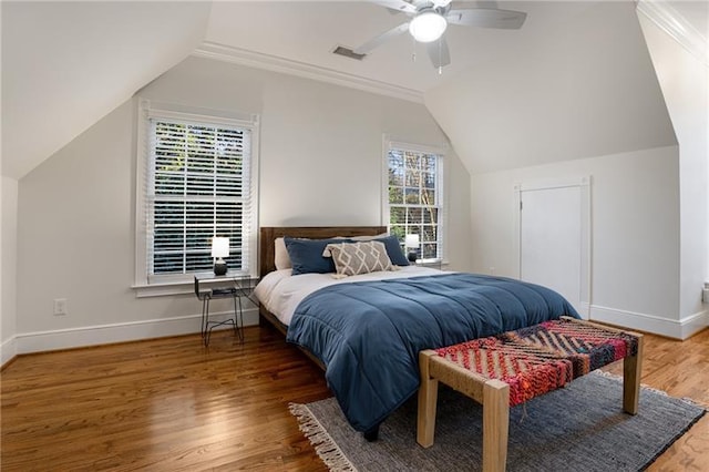 bedroom with ceiling fan, multiple windows, crown molding, and hardwood / wood-style flooring