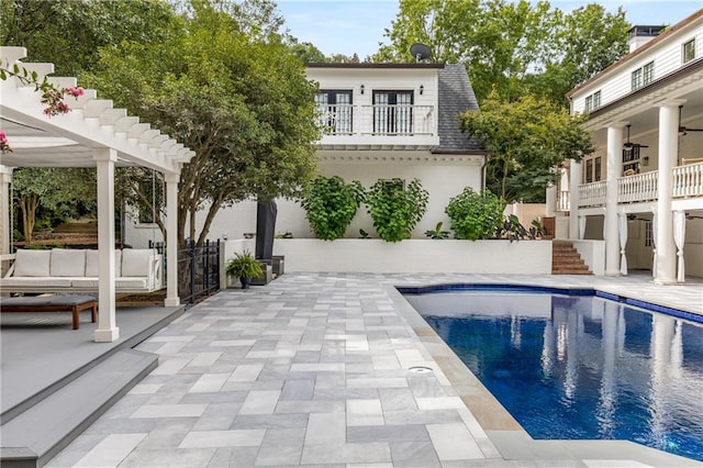 view of swimming pool featuring a pergola and a patio