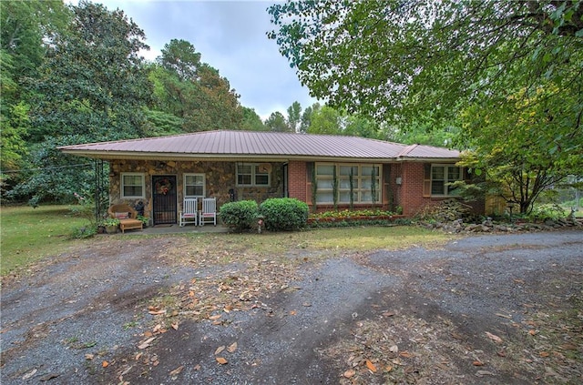 single story home with covered porch