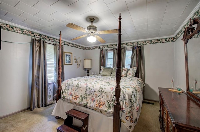 bedroom featuring light colored carpet, ceiling fan, and crown molding