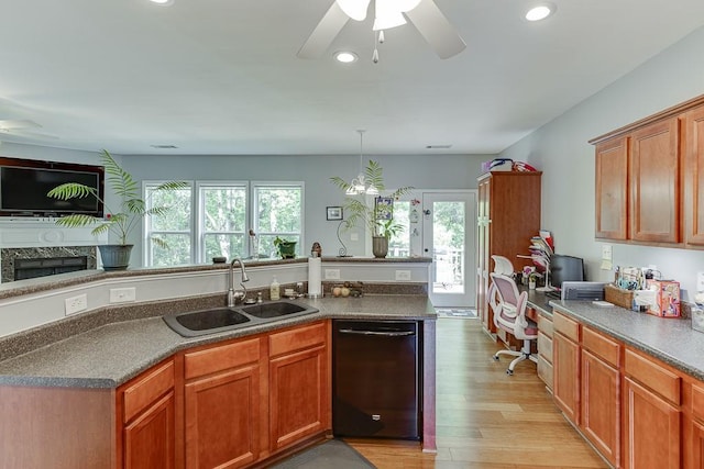 kitchen featuring black dishwasher, a sink, ceiling fan, healthy amount of natural light, and recessed lighting