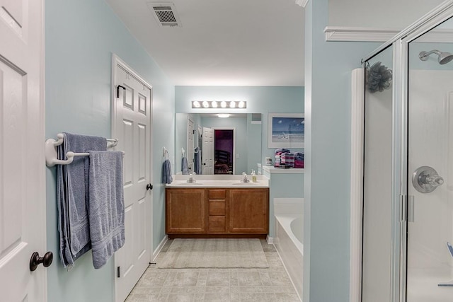 full bathroom featuring a shower stall, a bath, and double vanity
