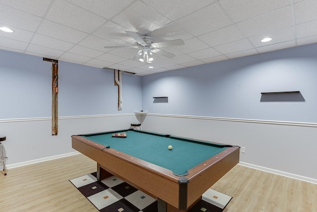 recreation room featuring wood finished floors, ceiling fan, baseboards, billiards table, and a paneled ceiling