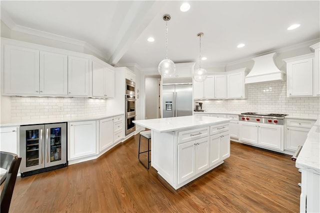 kitchen with decorative backsplash, built in appliances, custom exhaust hood, a center island, and wine cooler
