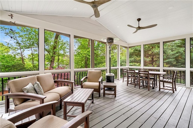 sunroom with outdoor lounge area, outdoor dining space, and ceiling fan