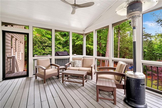sunroom / solarium featuring a wealth of natural light, ceiling fan, and outdoor lounge area