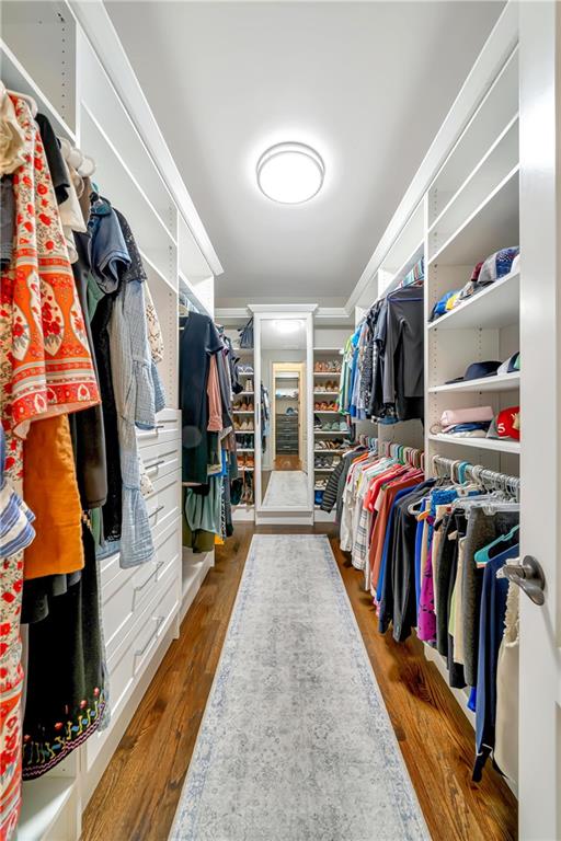spacious closet with wood finished floors
