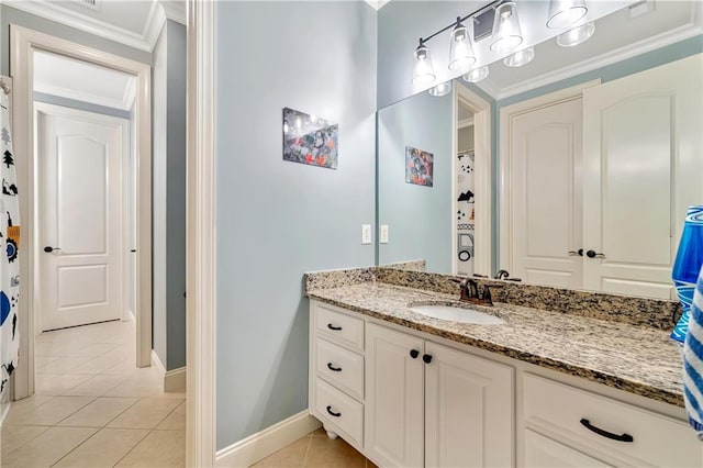full bathroom featuring vanity, ornamental molding, tile patterned flooring, and baseboards