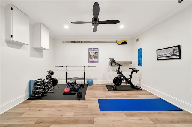 workout room with wood finished floors, crown molding, a ceiling fan, and recessed lighting
