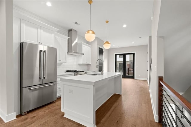 2329 Mason Dr Unit D24, Atlanta, GA 30316 - kitchen with freestanding refrigerator, wall chimney range hood, a sink, tasteful backsplash, and a kitchen island with sink