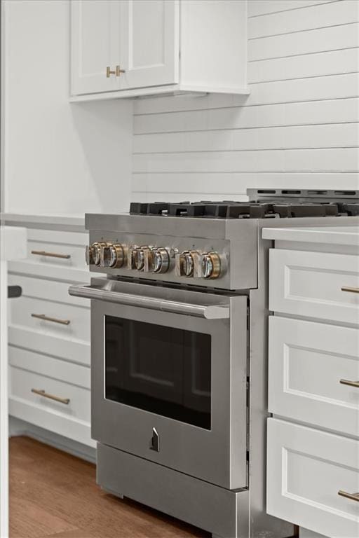 2329 Mason Dr Unit D24, Atlanta, GA 30316 - kitchen view of high end stainless steel range oven, white cabinetry, and wood finished floors