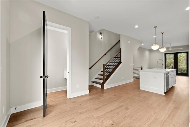 2329 Mason Dr Unit D24, Atlanta, GA 30316 - kitchen featuring a sink, light wood-style flooring, baseboards, and recessed lighting