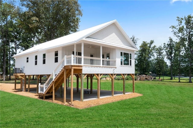 view of jungle gym with a yard, ceiling fan, and central air condition unit