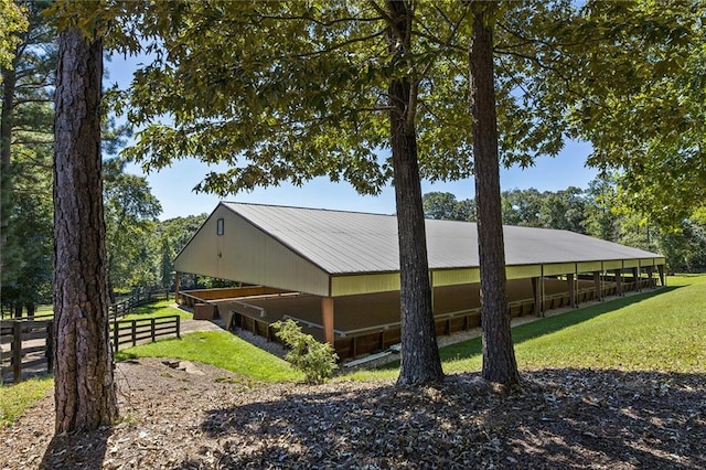 view of side of property with a lawn