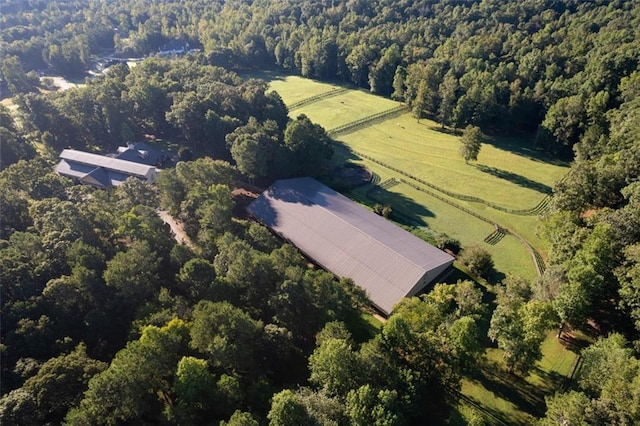 birds eye view of property with a rural view