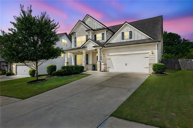 3940 Frasier Dr, Cumming, GA 30028 - craftsman-style house with board and batten siding, covered porch, concrete driveway, and stone siding