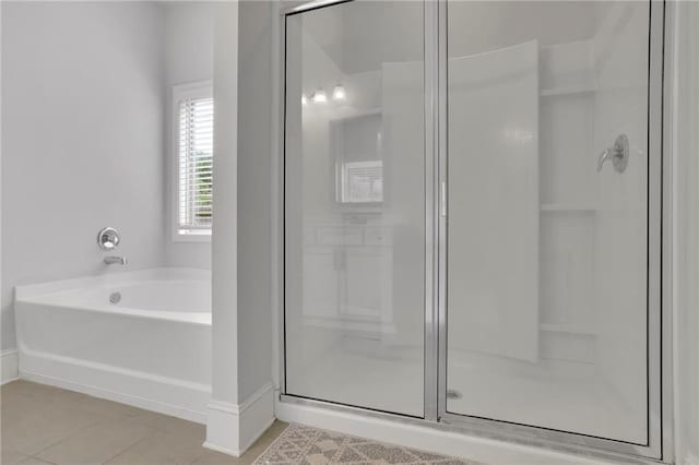 3940 Frasier Dr, Cumming, GA 30028 - bathroom with a shower stall, tile patterned floors, and a garden tub