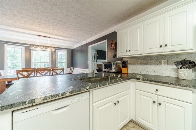 1623 Pratt Rd, Covington, GA 30014 - kitchen featuring white dishwasher, a peninsula, white cabinets, a textured ceiling, and dark stone counters
