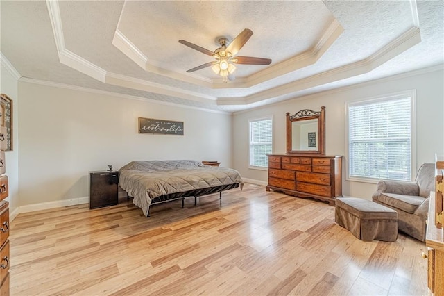1623 Pratt Rd, Covington, GA 30014 - bedroom with a raised ceiling, light wood-style floors, crown molding, a textured ceiling, and a ceiling fan