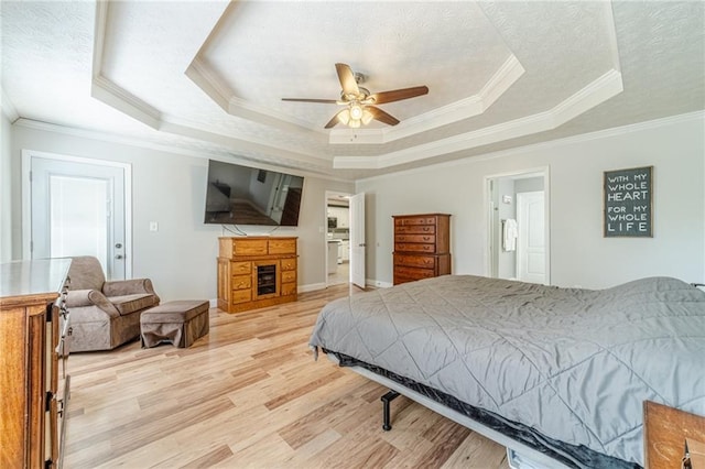 1623 Pratt Rd, Covington, GA 30014 - bedroom with a tray ceiling, crown molding, light wood-style floors, and ceiling fan