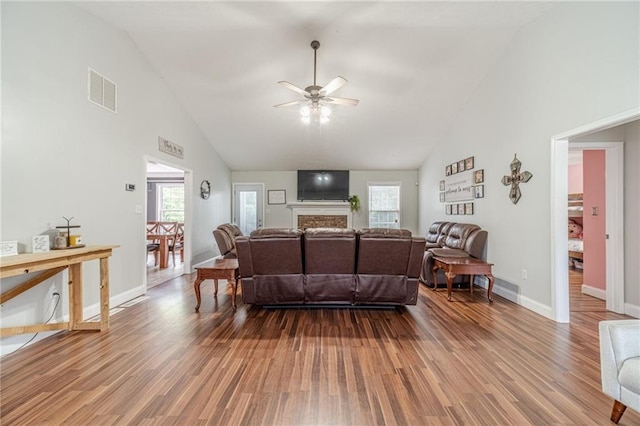 1623 Pratt Rd, Covington, GA 30014 - living room featuring ceiling fan, wood finished floors, high vaulted ceiling, and a fireplace