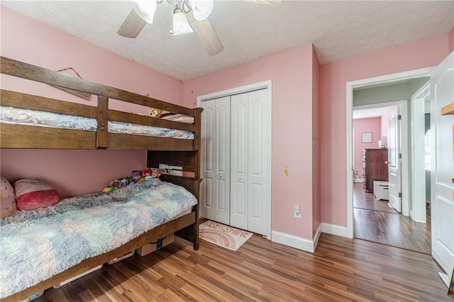 1623 Pratt Rd, Covington, GA 30014 - bedroom featuring wood finished floors, a textured ceiling, ceiling fan, and a closet