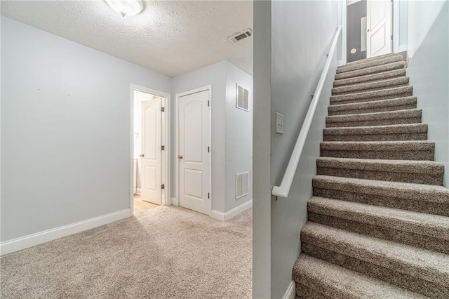 1623 Pratt Rd, Covington, GA 30014 - staircase with carpet flooring and a textured ceiling