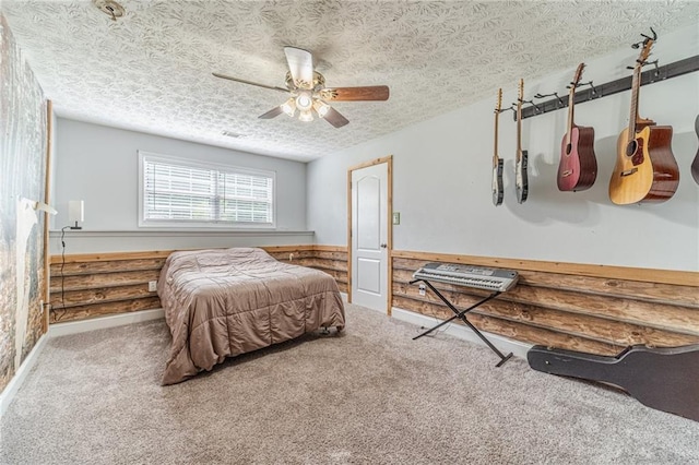 1623 Pratt Rd, Covington, GA 30014 - bedroom featuring carpet floors, a textured ceiling, ceiling fan, and wainscoting