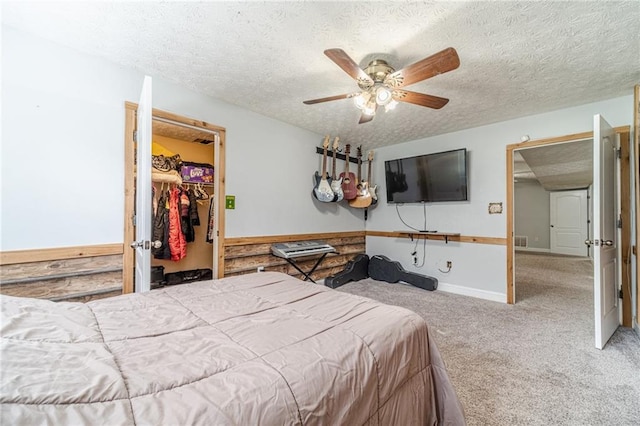 1623 Pratt Rd, Covington, GA 30014 - bedroom with a textured ceiling, carpet floors, a spacious closet, ceiling fan, and a closet
