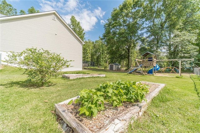 1623 Pratt Rd, Covington, GA 30014 - view of yard with a storage unit, a playground, and a vegetable garden