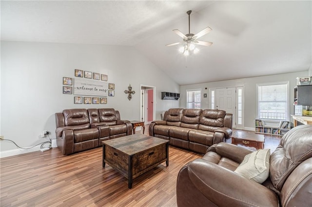 1623 Pratt Rd, Covington, GA 30014 - living room with light wood-style flooring, lofted ceiling, a ceiling fan, and healthy amount of natural light