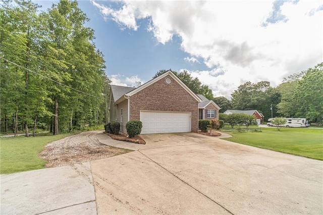 1623 Pratt Rd, Covington, GA 30014 - view of side of home featuring brick siding, concrete driveway, a yard, and an attached garage