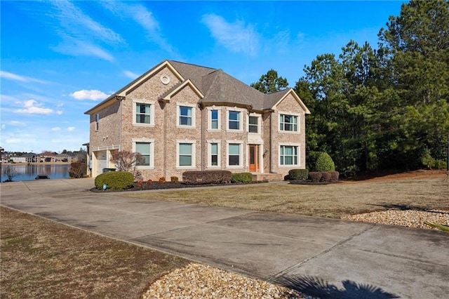 view of front of house with a garage and a front yard