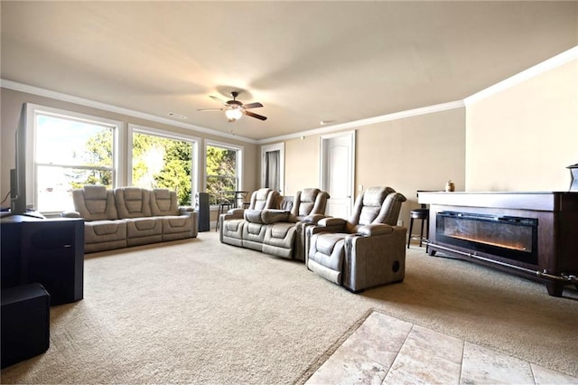 living room with ornamental molding, light carpet, and ceiling fan