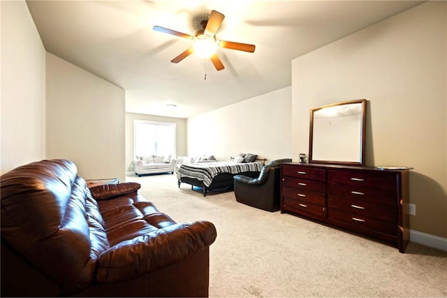 carpeted living room featuring ceiling fan