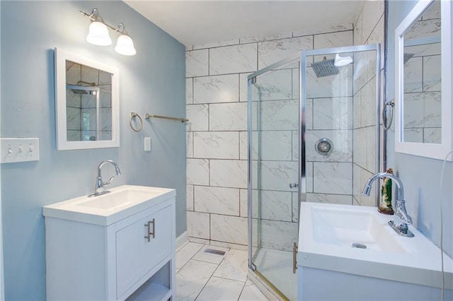 bathroom with a stall shower, marble finish floor, and vanity
