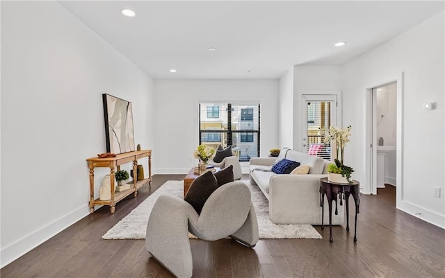 living room with dark hardwood / wood-style flooring