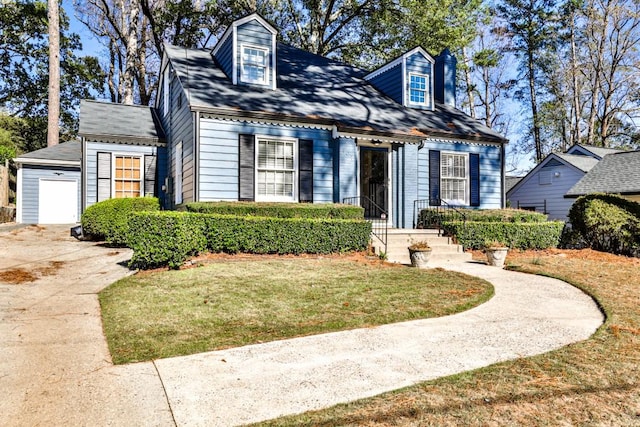 cape cod home featuring a front lawn